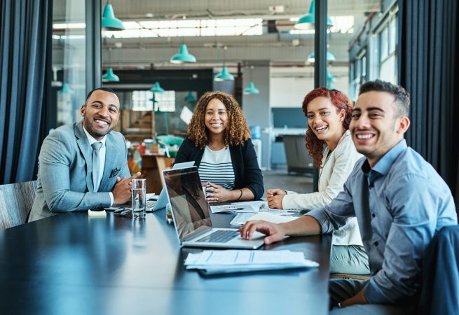 Portrait of a group of businesspeople having a meeting in an office.