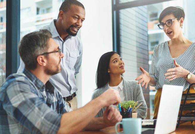 Working together to get the task done. Shot of businesspeople working together in the office