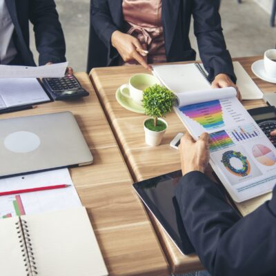 Group of business people meeting in conference room brainstorming consult business document graph chart office desk. Diversity multiethnic group of business people brainstorming and working together.
